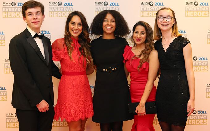 2019 Everyday Heroes guests standing together smiling.